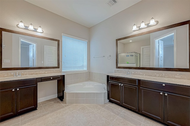 bathroom featuring tile patterned floors, vanity, and plus walk in shower