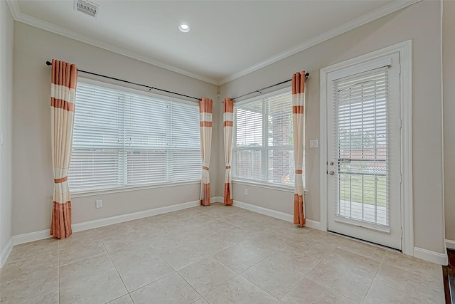 interior space with light tile patterned floors and ornamental molding