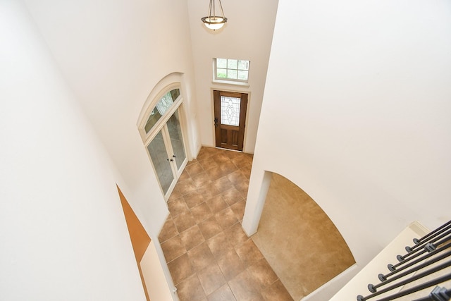 entryway with a high ceiling