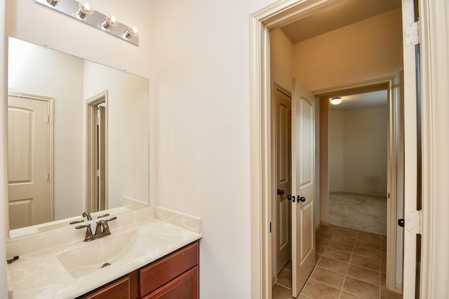 bathroom with tile patterned floors and vanity