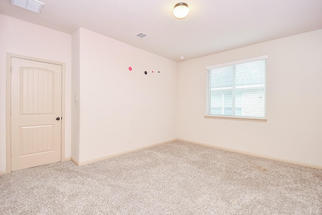 unfurnished room featuring carpet flooring