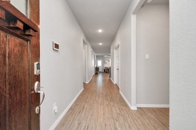 hallway with light wood-type flooring