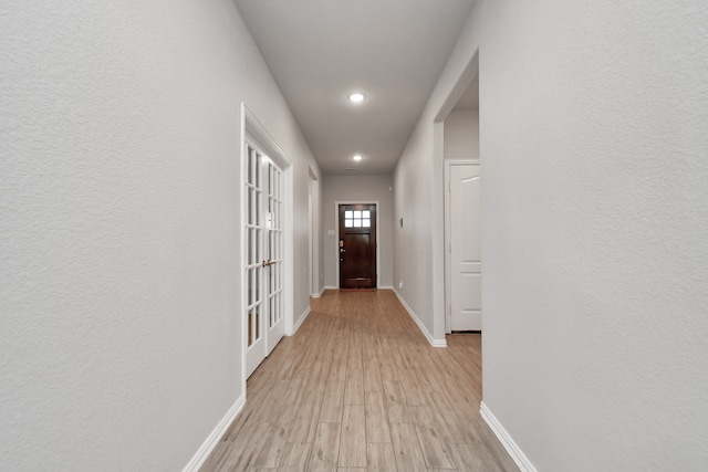 hallway featuring light hardwood / wood-style flooring