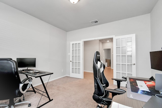 home office featuring light carpet and french doors