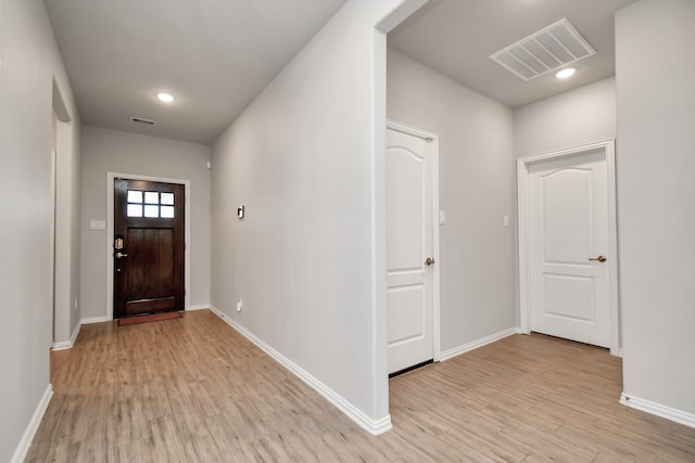 foyer with light wood-type flooring