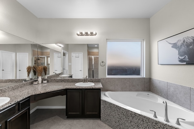 bathroom featuring tile patterned flooring, vanity, and separate shower and tub