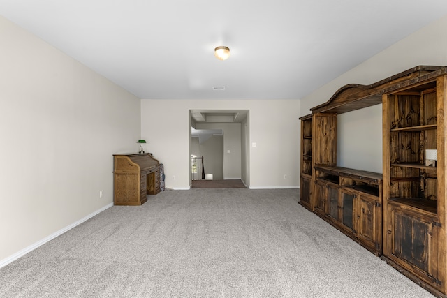 unfurnished living room featuring carpet flooring