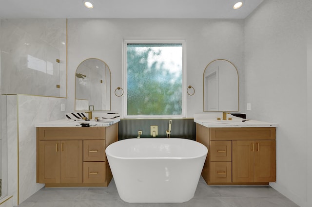 bathroom featuring vanity and shower with separate bathtub