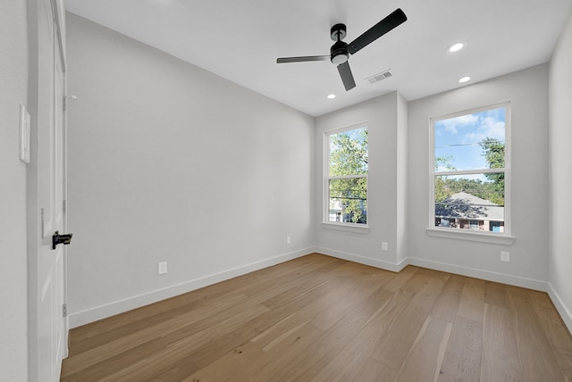 empty room with light hardwood / wood-style floors and ceiling fan