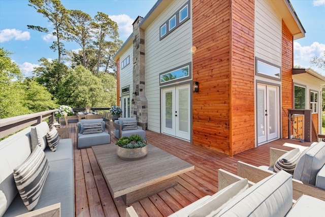 wooden deck featuring french doors and an outdoor hangout area