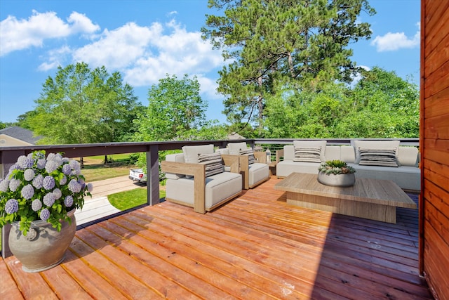 wooden terrace with an outdoor hangout area