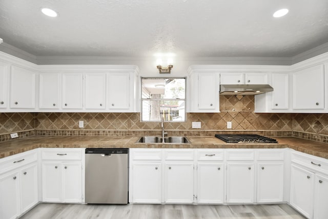 kitchen with sink, white cabinetry, and stainless steel appliances