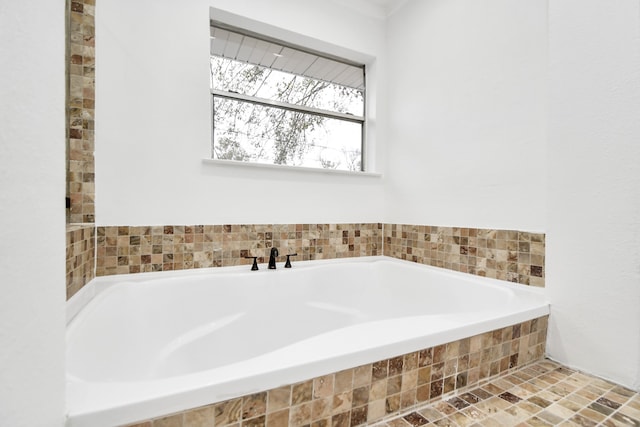 bathroom with tiled tub