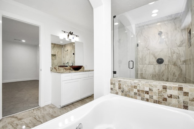 bathroom with vanity and independent shower and bath