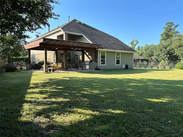 rear view of property featuring a lawn, ceiling fan, and a patio area