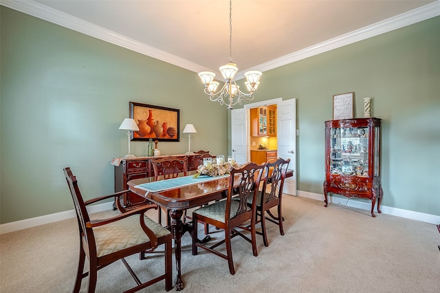 dining area featuring a chandelier, light colored carpet, and crown molding