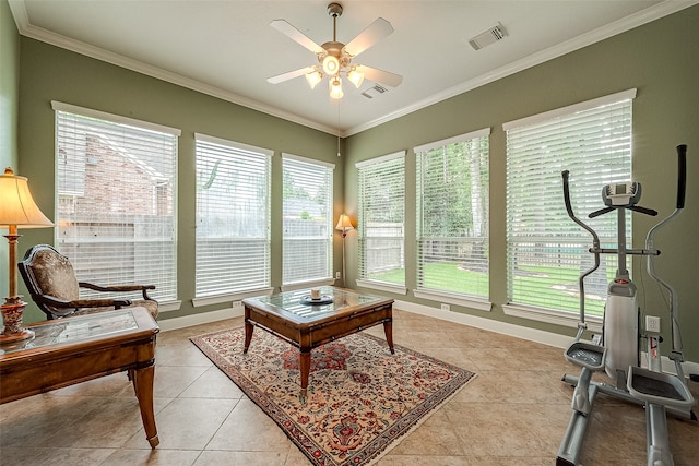 interior space with light tile patterned floors, ceiling fan, and crown molding