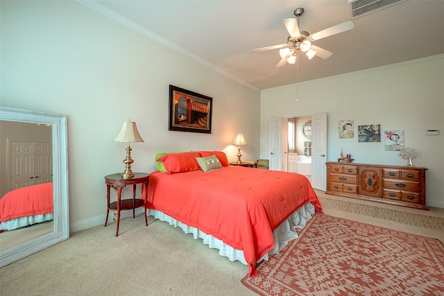 bedroom with ceiling fan, light colored carpet, and ornamental molding