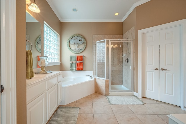 bathroom with plus walk in shower, vanity, tile patterned floors, and crown molding