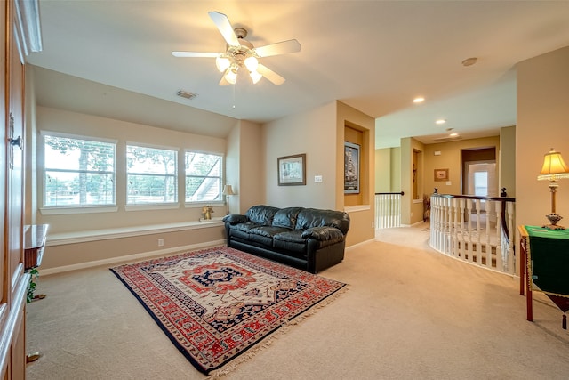 carpeted living room featuring ceiling fan