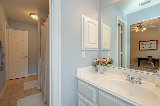 bathroom with vanity, tile patterned floors, ceiling fan, and curtained shower