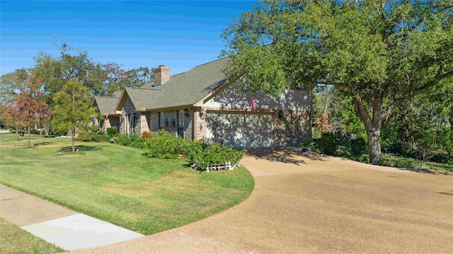 view of front of house with a garage and a front lawn