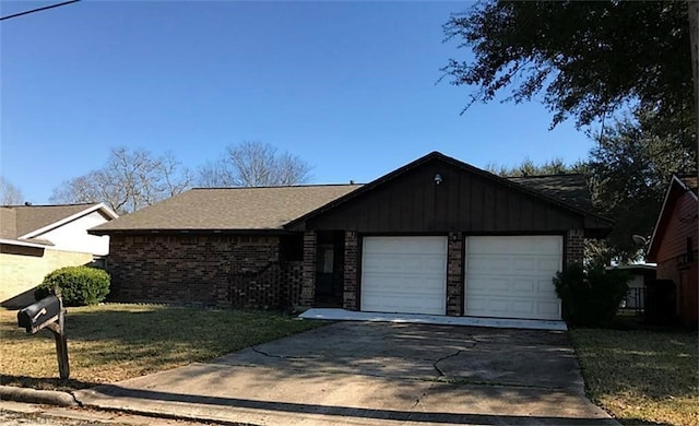 single story home with a garage and a front lawn