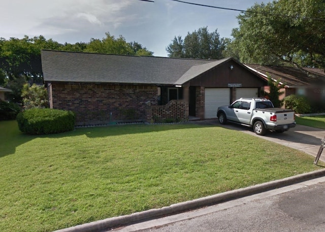 ranch-style home with a front lawn and a garage