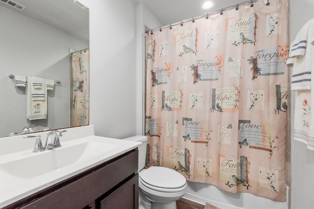 full bathroom featuring toilet, vanity, and shower / bathtub combination with curtain