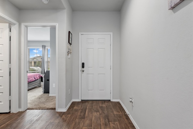 corridor featuring dark hardwood / wood-style floors