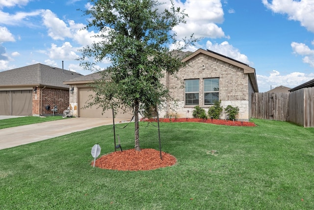 view of front of home featuring a garage and a front yard