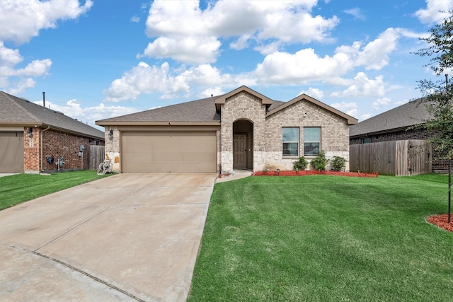 view of front of property with a front lawn and a garage