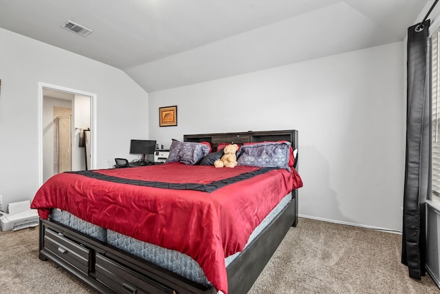 carpeted bedroom with lofted ceiling