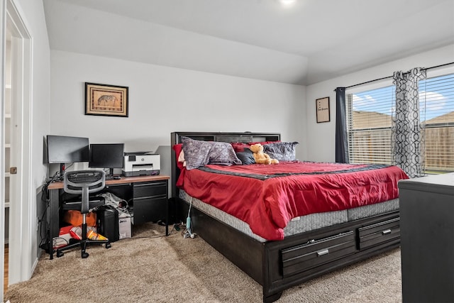 carpeted bedroom with vaulted ceiling