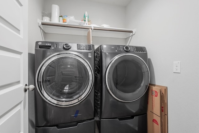 clothes washing area with independent washer and dryer