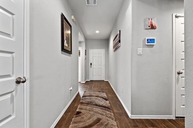 corridor featuring dark hardwood / wood-style floors