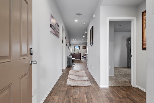 hall featuring dark wood-type flooring