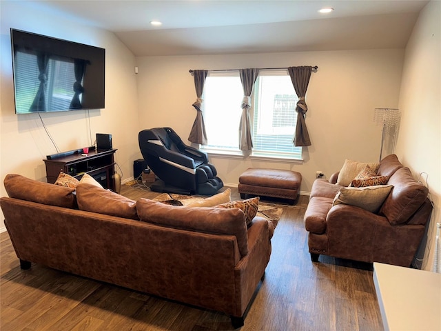 living room with hardwood / wood-style floors and vaulted ceiling