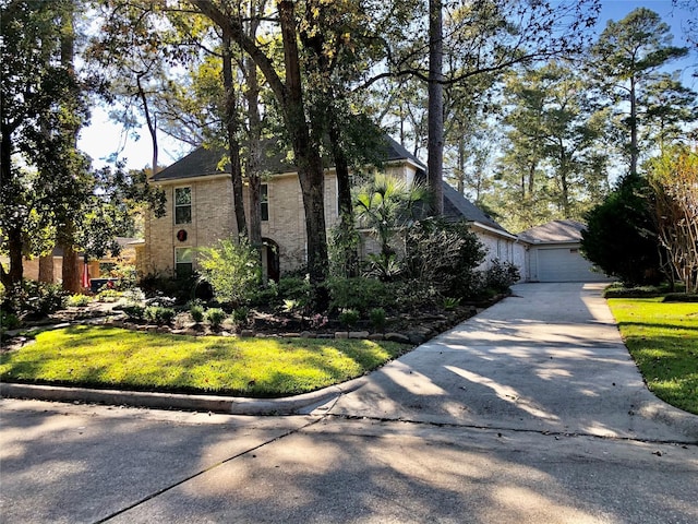 view of front of house featuring a garage and a front yard