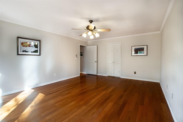 unfurnished bedroom featuring dark hardwood / wood-style flooring, crown molding, a closet, and ceiling fan