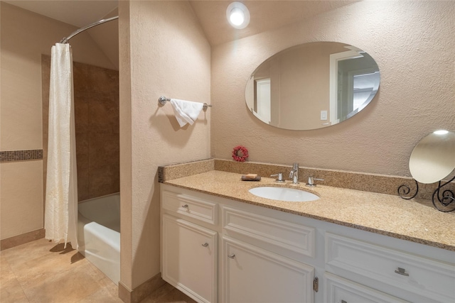 bathroom featuring vanity and shower / bath combination with curtain