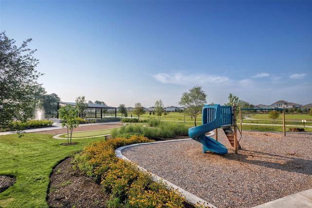 view of playground with a yard