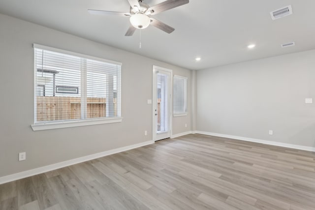 unfurnished room featuring ceiling fan and light hardwood / wood-style floors