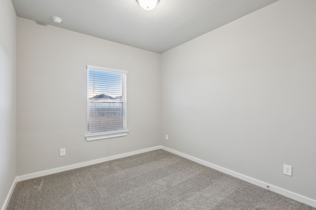 empty room featuring carpet flooring