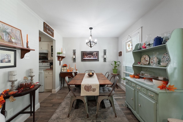 dining space featuring an inviting chandelier and dark wood-type flooring