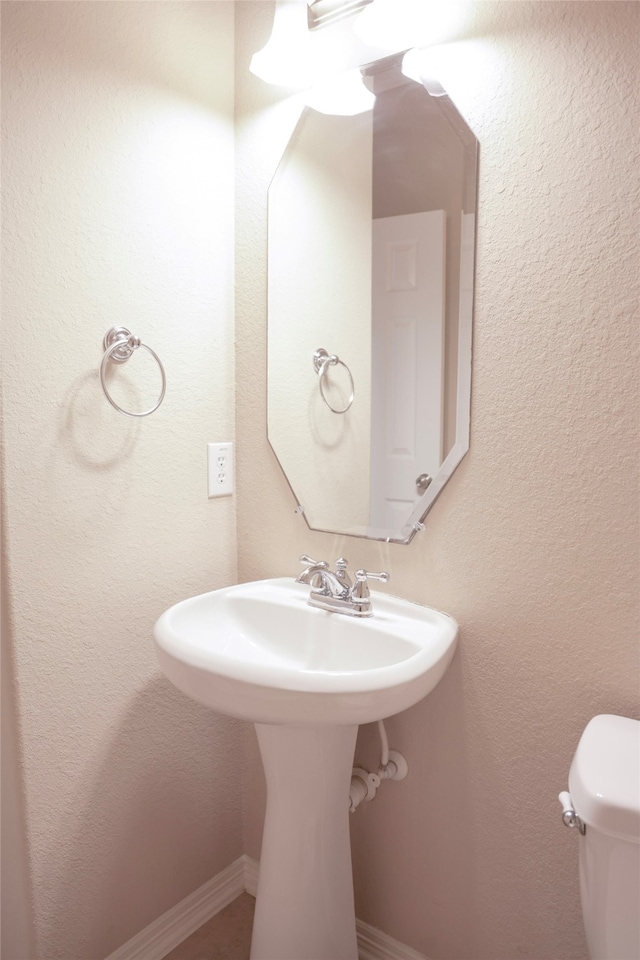 bathroom featuring toilet