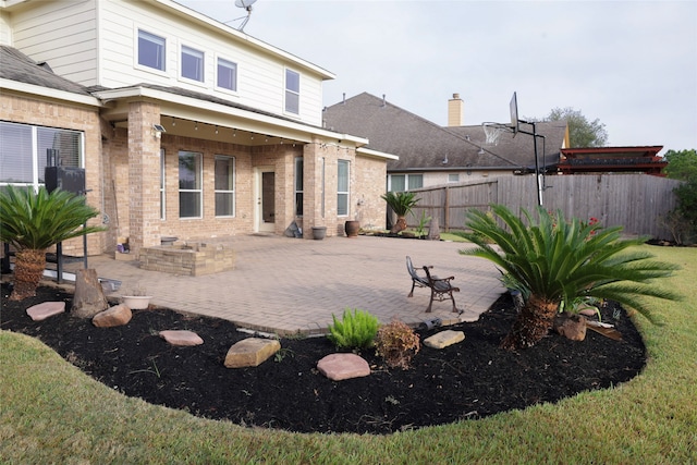 back of house with a patio area