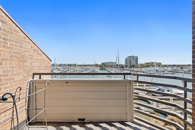 balcony featuring a water view