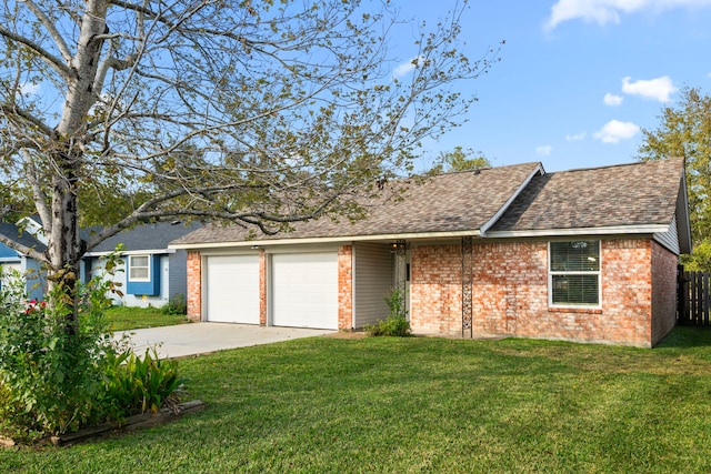 single story home with a front yard and a garage