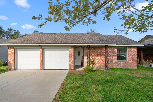 ranch-style home featuring a front yard and a garage